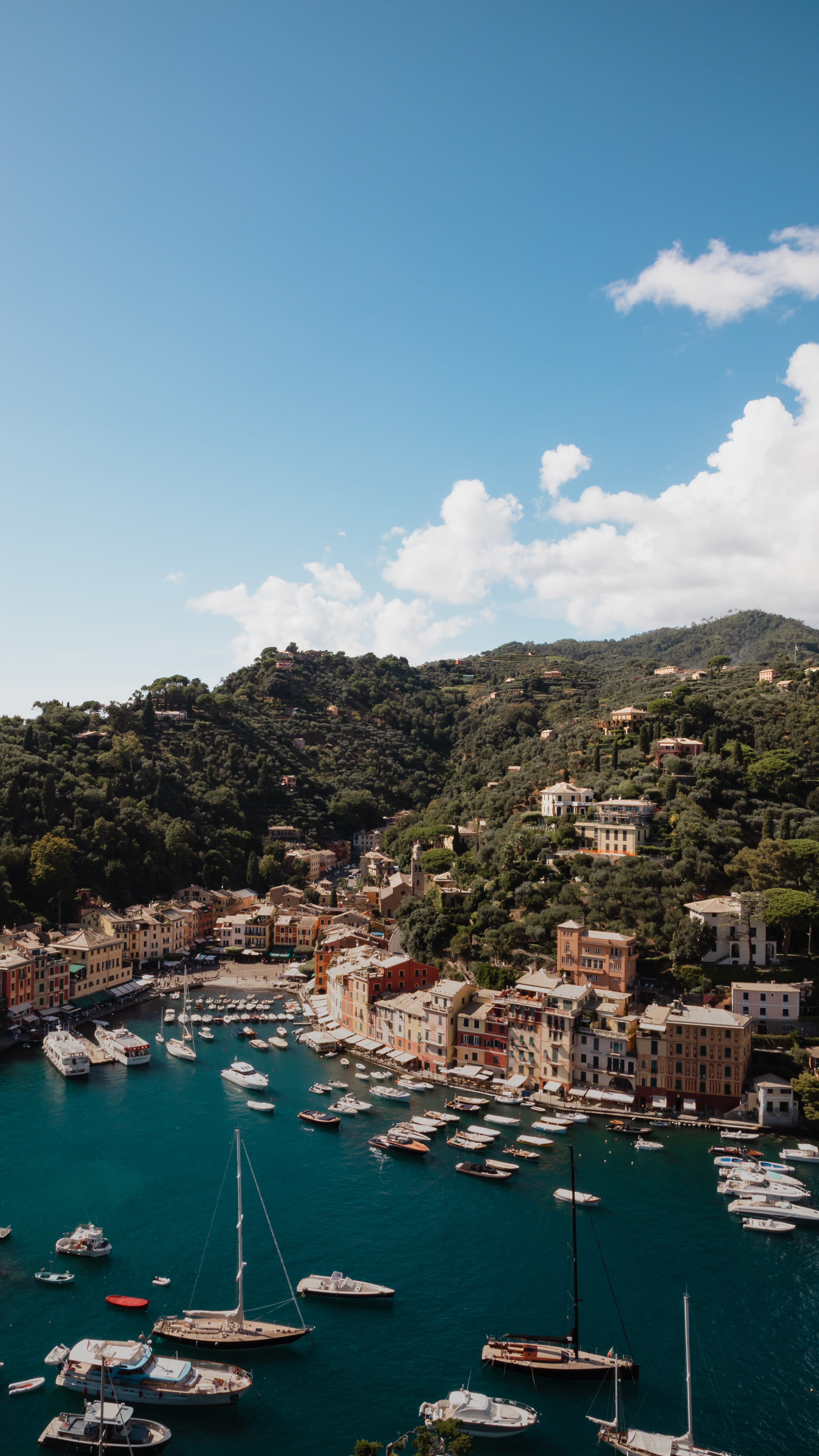 view of a village and the ocean during daytime
