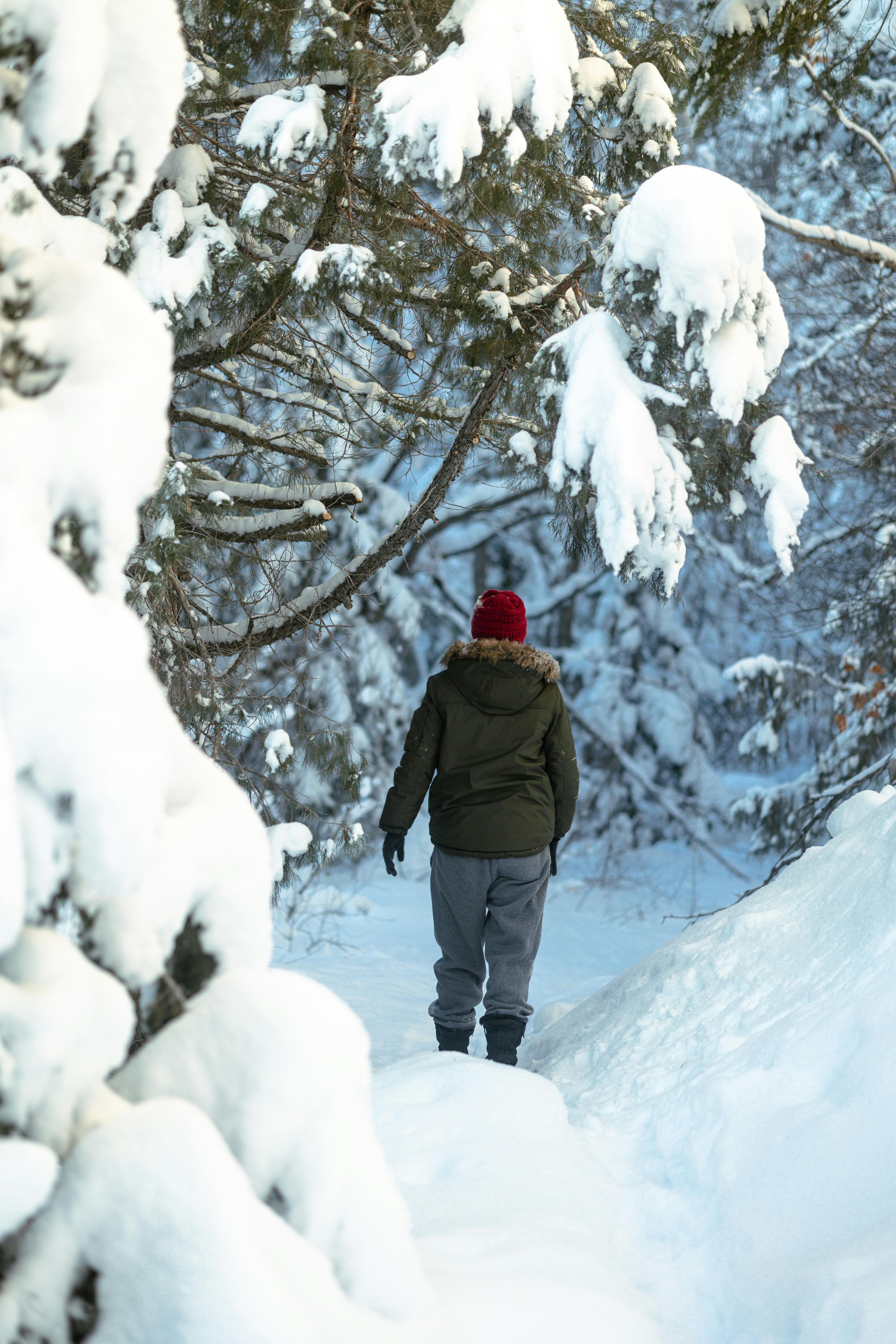 A woman on a snowy mountain looking happy