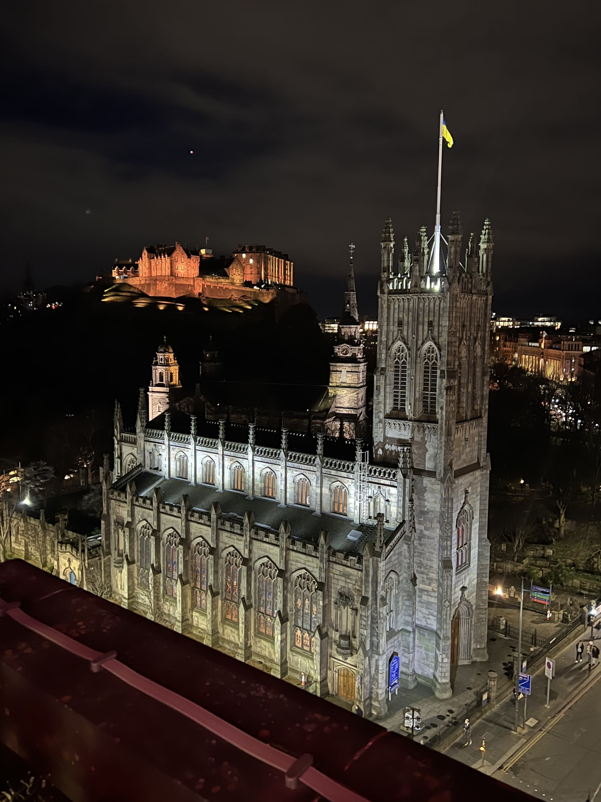 An aerial view of a castle-like building during nighttime