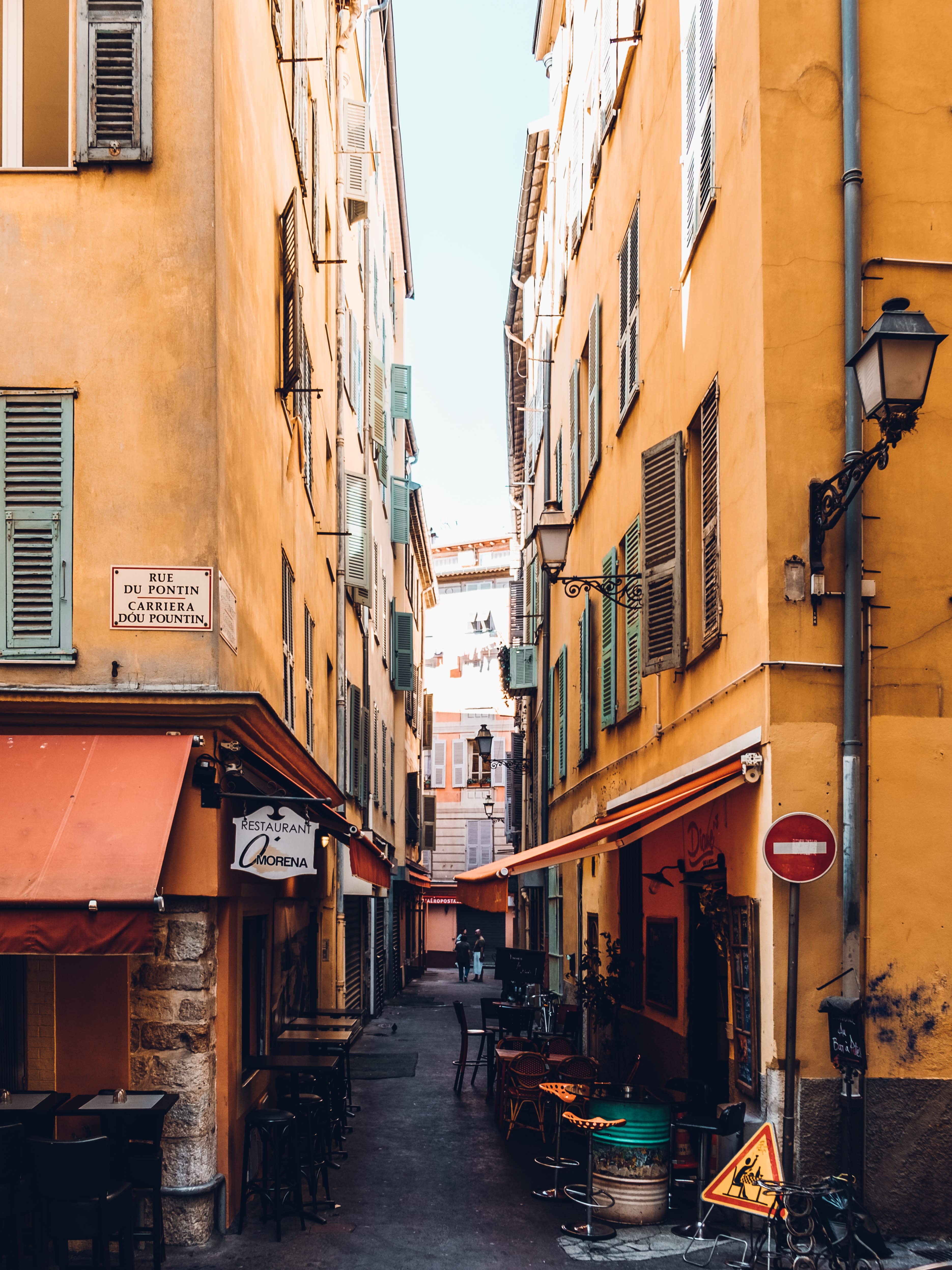 French riviera small streets and yellow buildings.