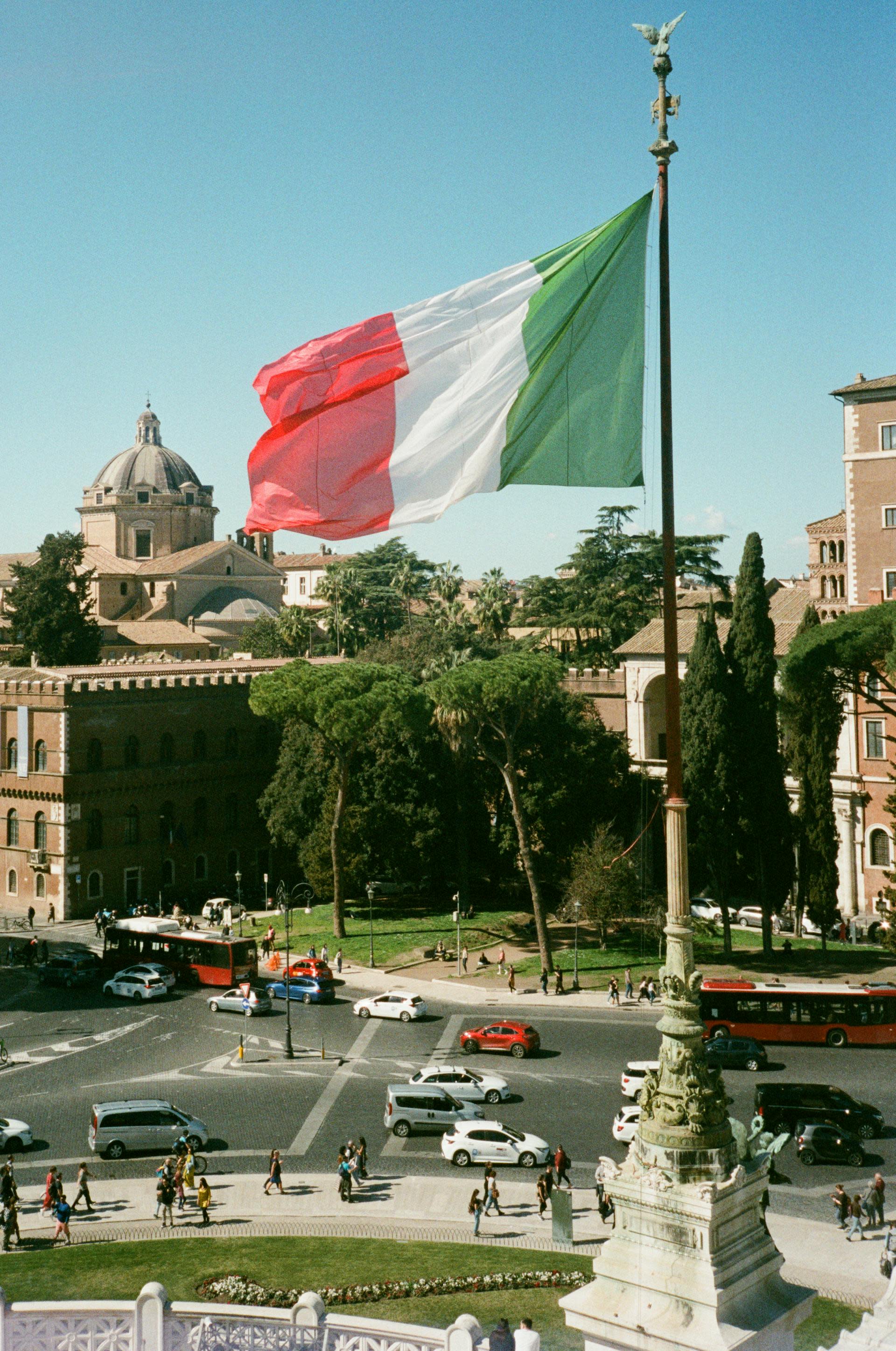 The Italian flag flying outside of a building you might see on a 2 day rome itinerary.