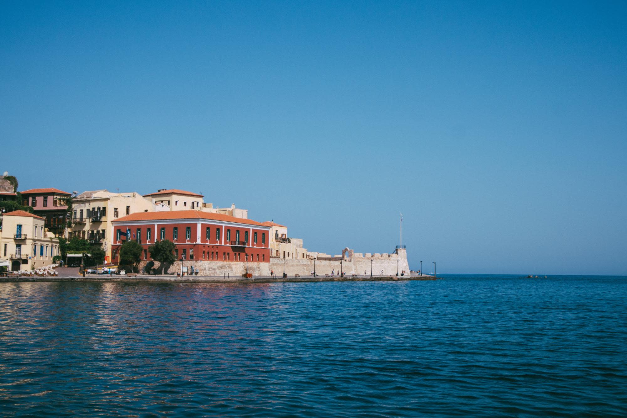 Sea with orange and white building.