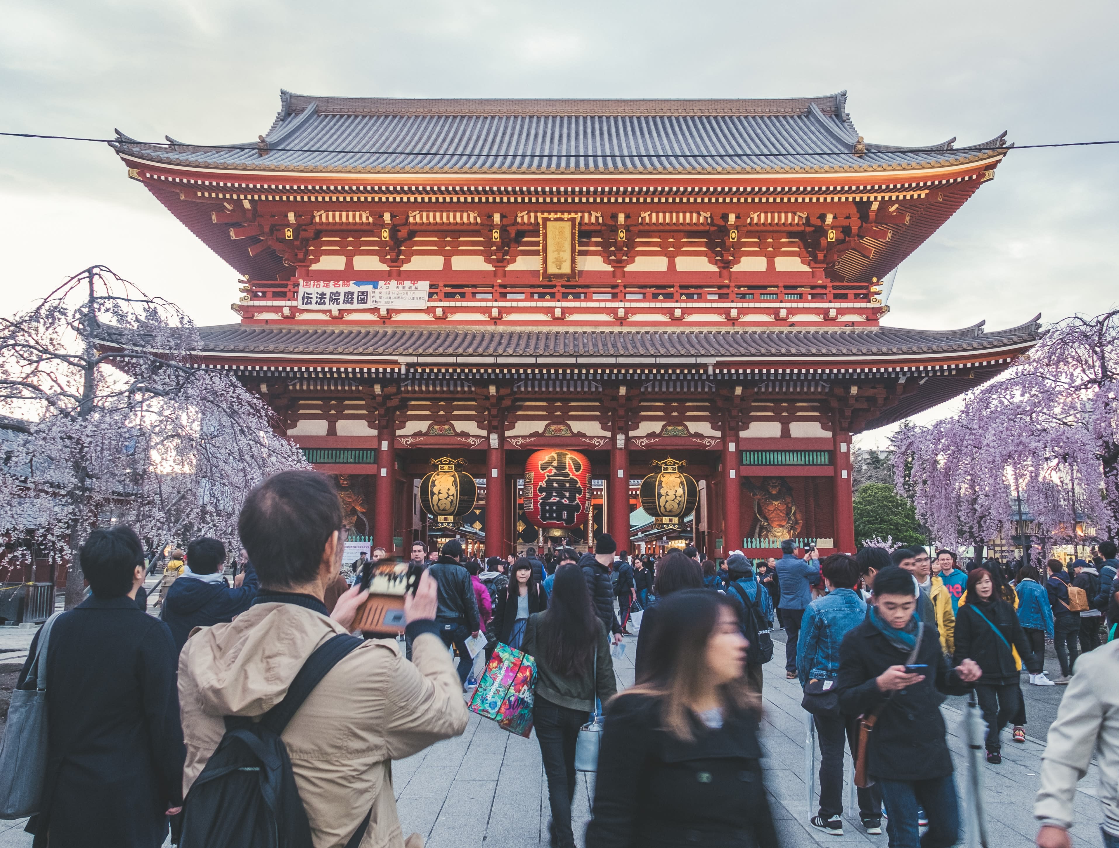people standing in front of temple