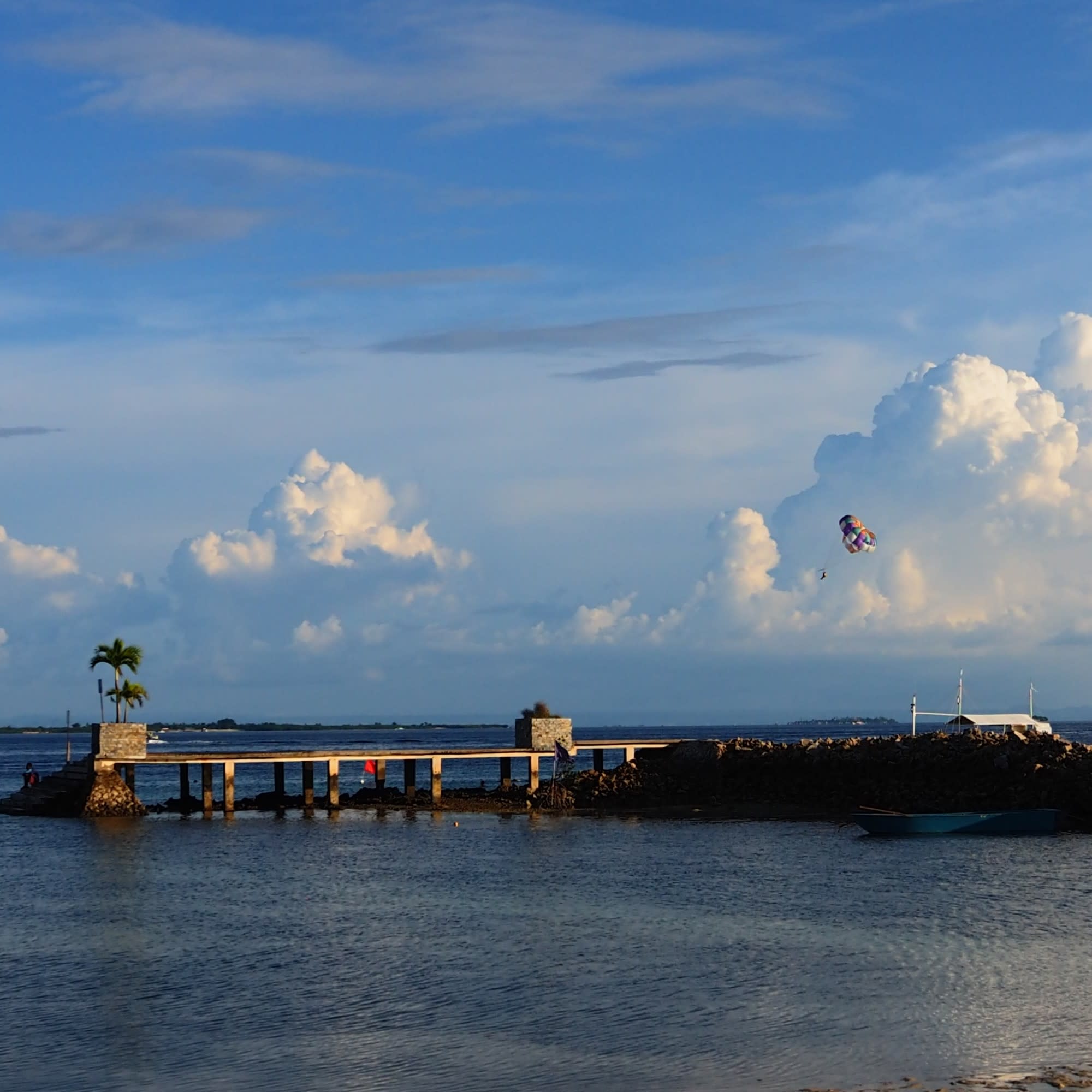 An aerial view of the pier near the water during the daytime.