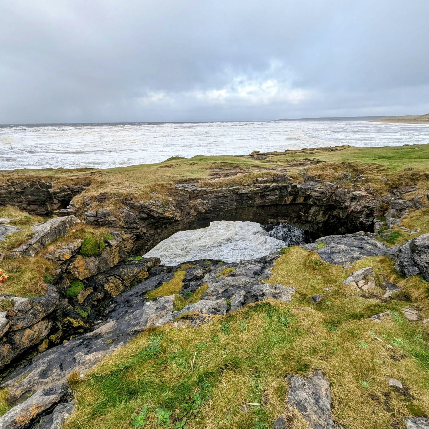 Rocky area with hole near the ocean on an Ireland 10 day itinerary.