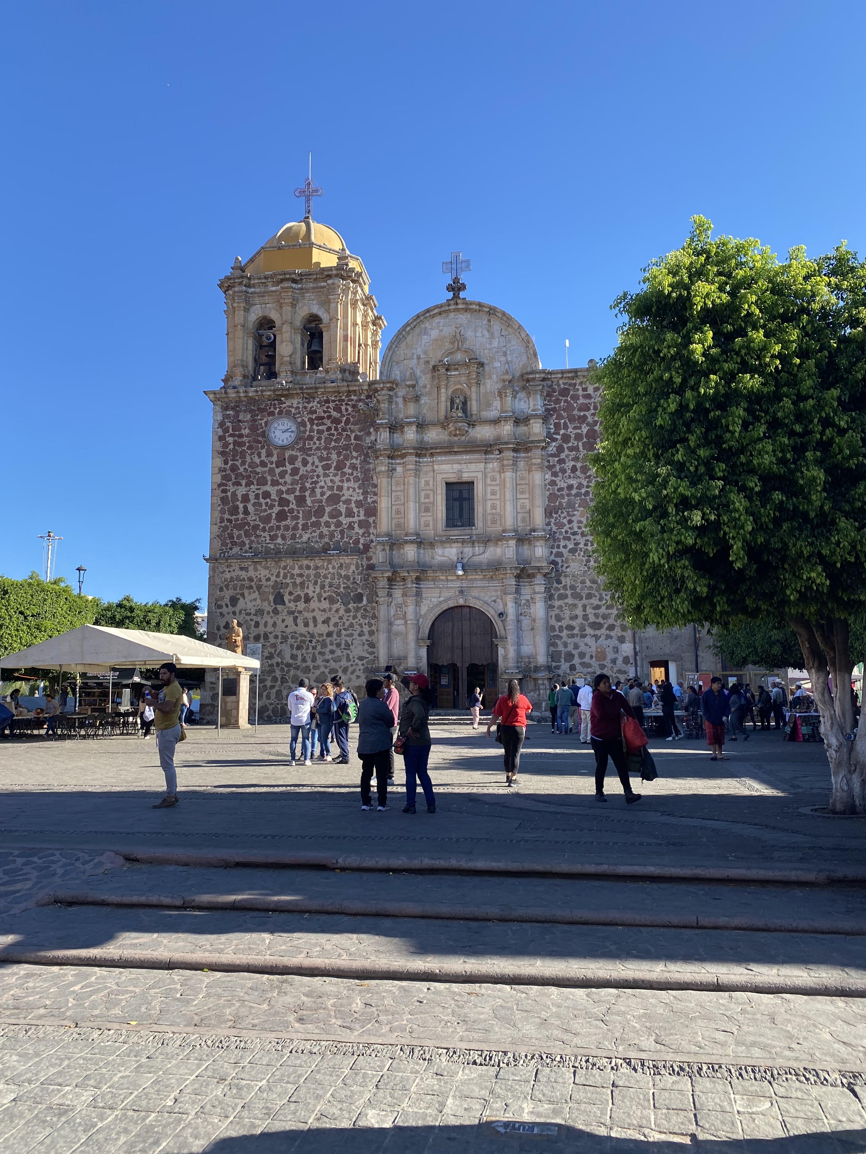 People in front of an old church.