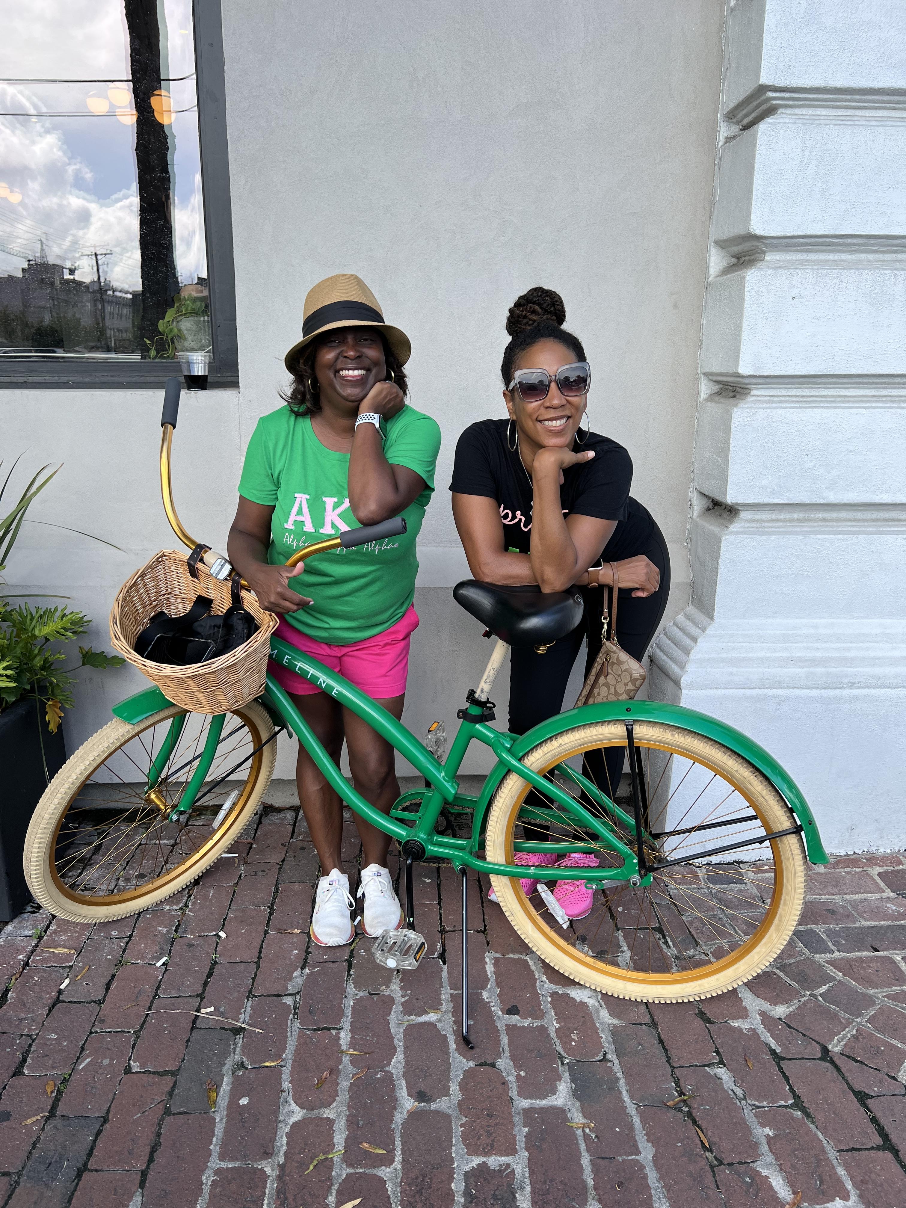 A image of girls enjoying a nice day with bicycles