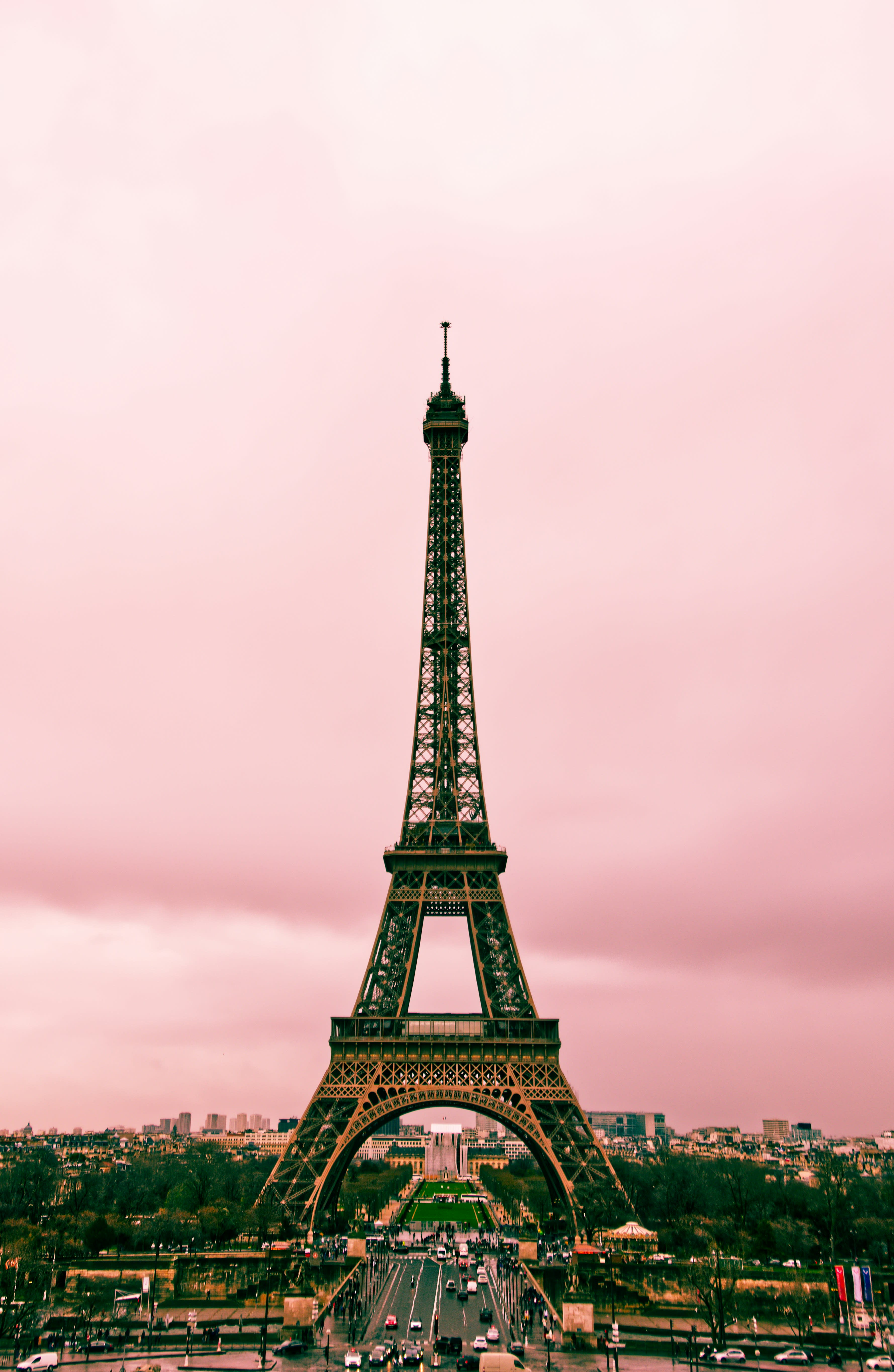 The Eiffel Tower set against the backdrop of a pink sky.