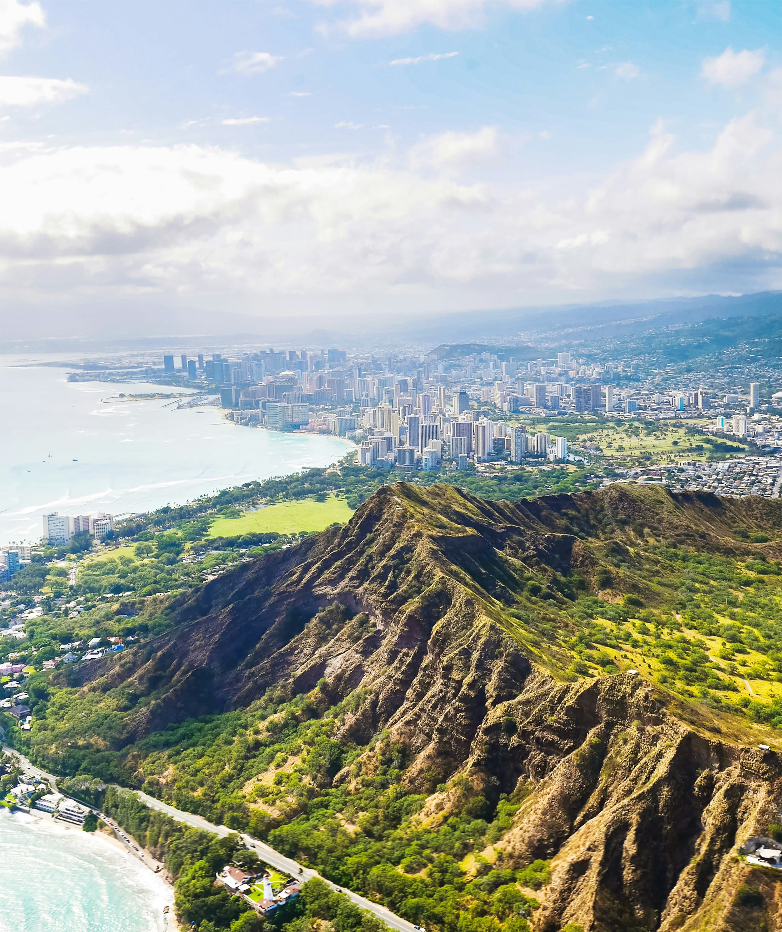 Diamond Head with the city of Oahu in the background and the ocean to the west.