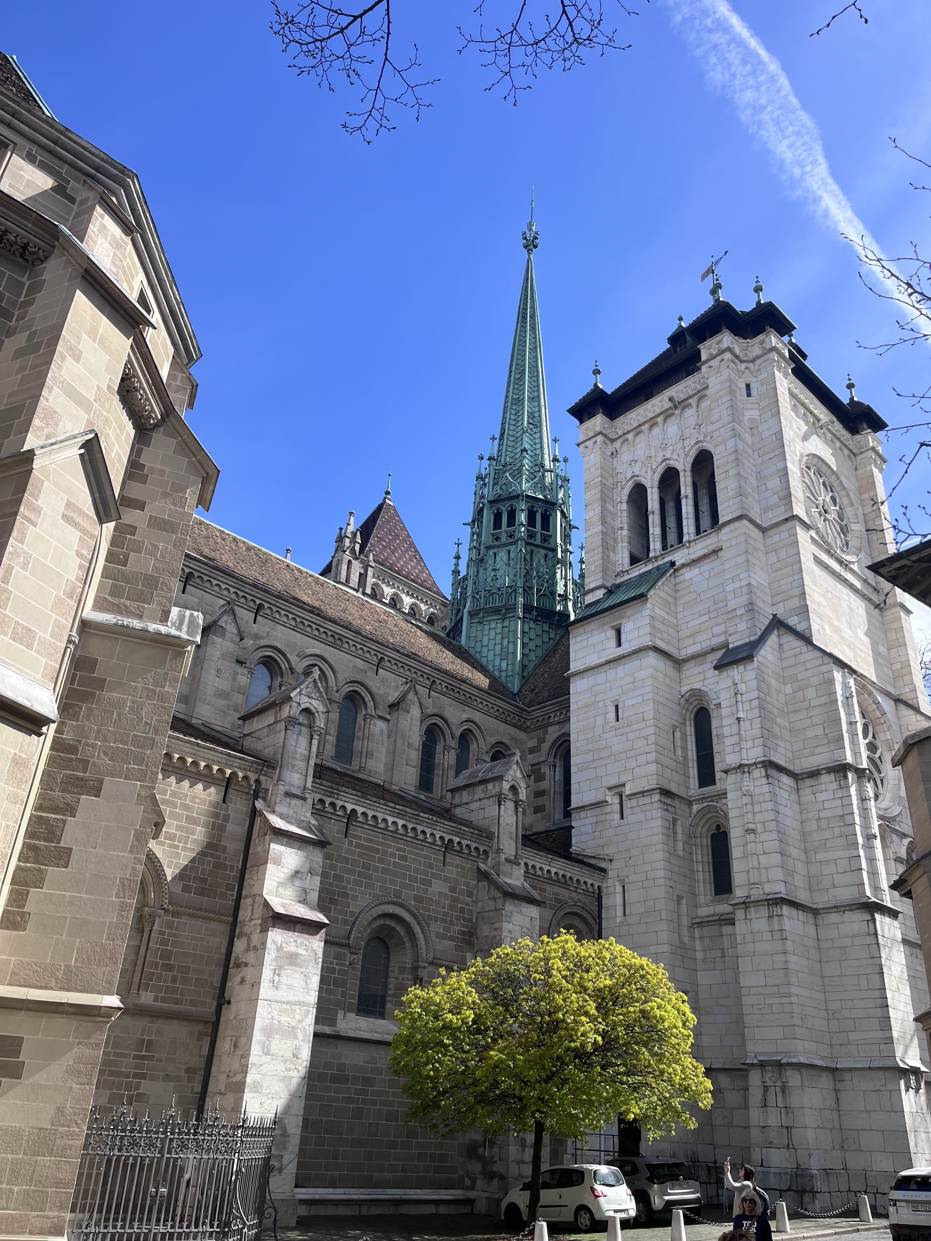 A tall chapel and other buildings during the daytime