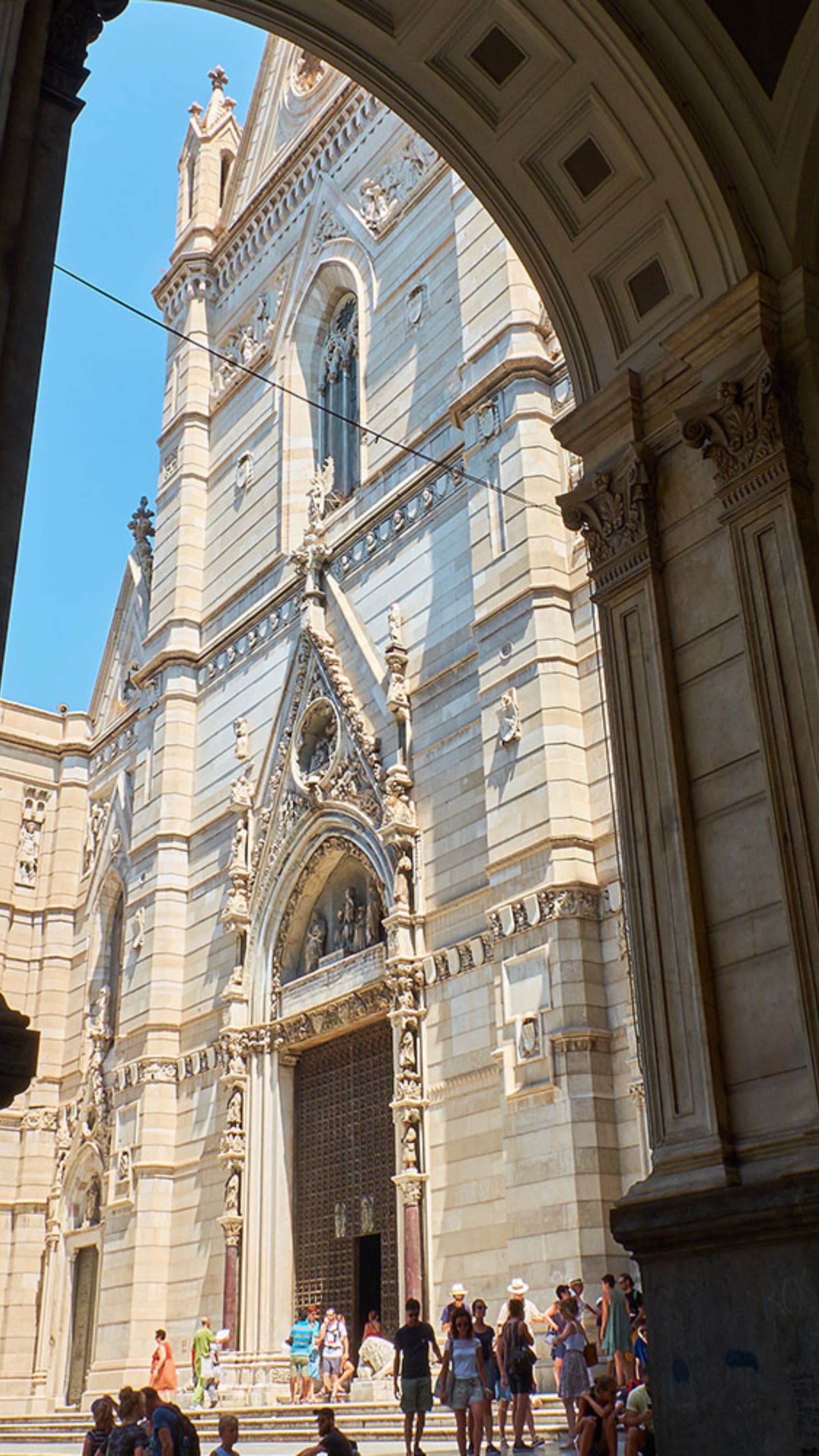 A picture of a European building taken from a window.
