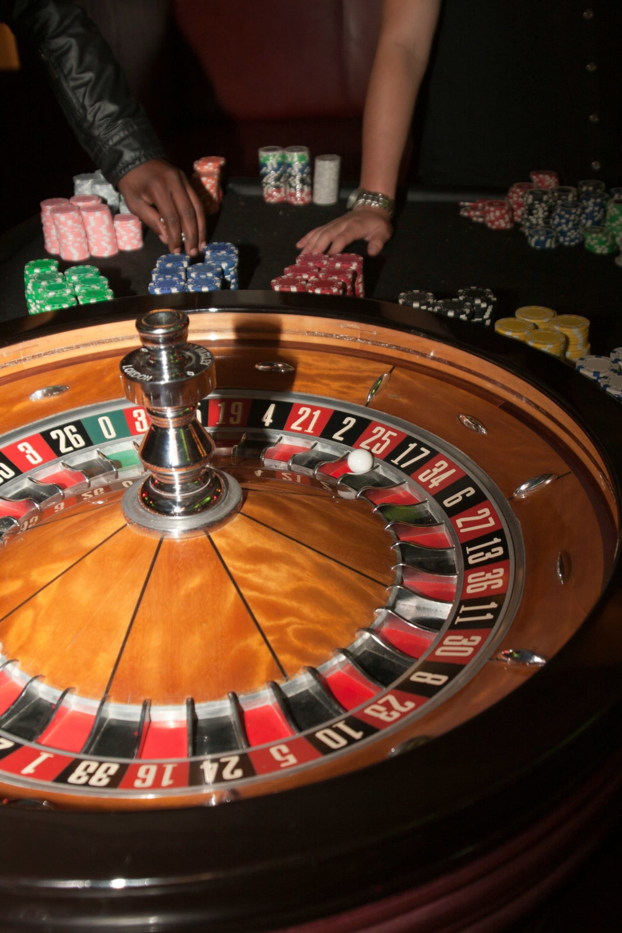 A picture of Stainless-steel round on brown wooden table
