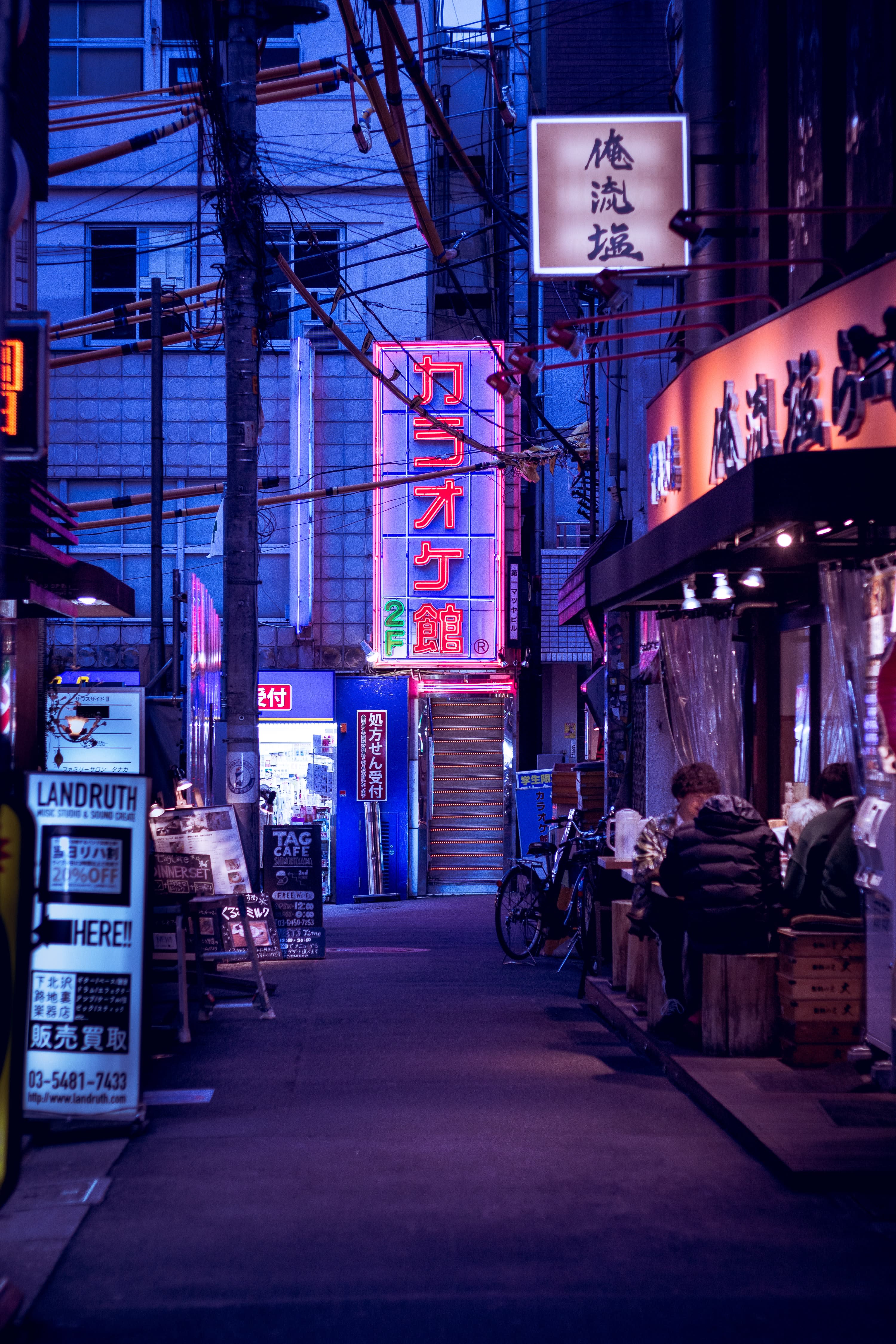 A neon-lit street in Tokyo, Japan.