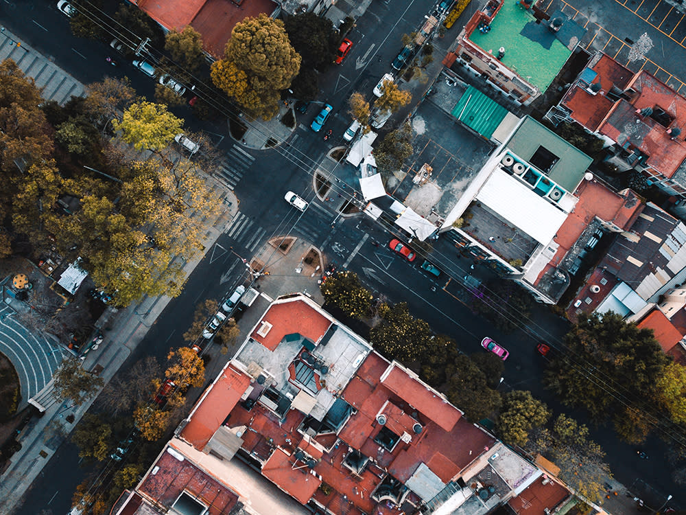 Aerial view of Mexico with green white and red roofs street with cars